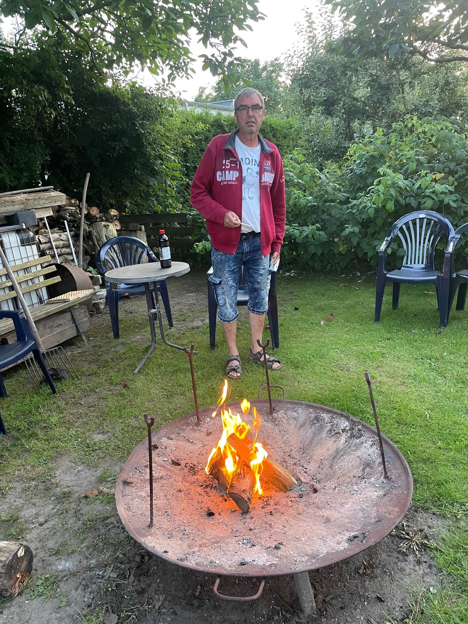 person-beside-garden-fire-pit-01